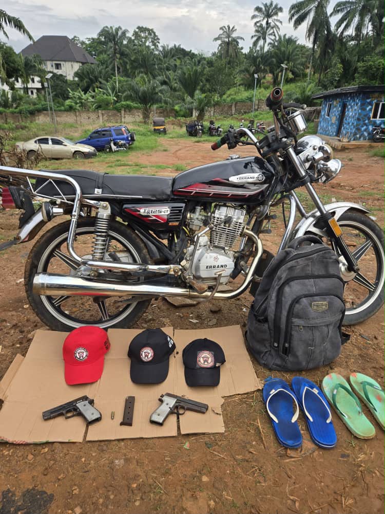 Police recovers abandoned motorcycle with pistols and three caps bearing secret cult incription in Anambra